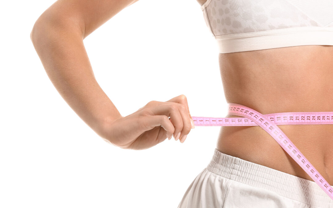Beautiful young woman with measuring tape on white background. Weight loss concept